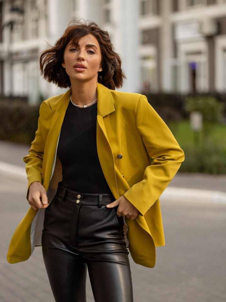 Gwendoline double-breasted blazer in mustard yellow on a city street